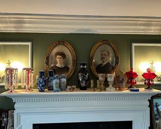 The beautiful mantle is covered with superb sets of glass and pottery! 