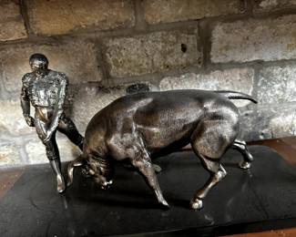 A beautiful Matador and Bull sculpture on Black Marble.