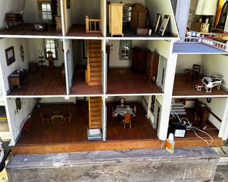 A very large 3 story doll house complete with furniture! 