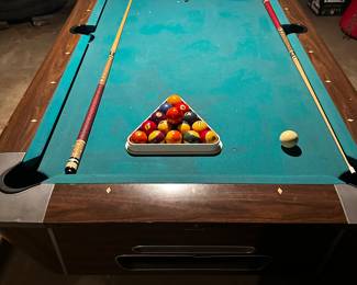 A beautiful vintage Slate Pool table by Valley Pool Tables of Bay City, MI. Cues and balls included! (Note: The 8 ball is missing, but another ball is included with the set ~ easily replaced.)