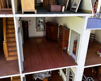 A very large 3 story doll house complete with furniture! 
