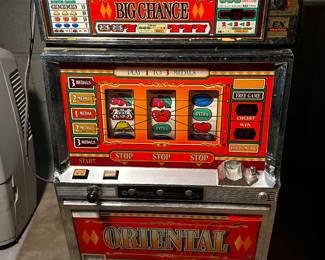 This is a vintage ORIENTAL SLOT MACHINE! 