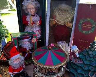 Here we have a large lot of motion Christmas Figurines! The carousel in the middle is a Mr. Christmas piece! 