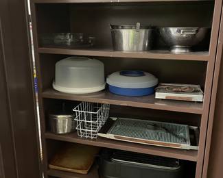 Large metal cabinet with cookware 