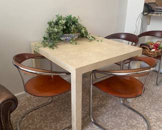 FAUX ANIMAL SKIN TABLE(SMALL DAMAGE ON TABLE TOP)  AND 4 ITALIAN ARRBEN LEATHER CHAIRS(DISCOLORED)