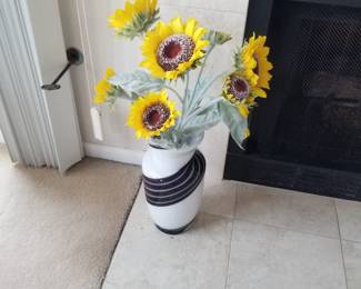 Large glass vase; faux sunflowers