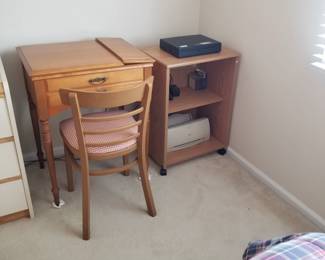 Sewing machine; chair; small printer table on wheels