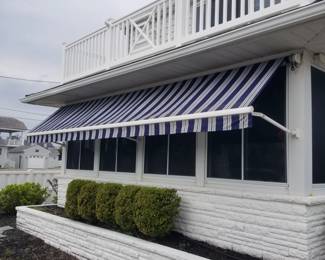 Electric awning extends approximately 3 feet