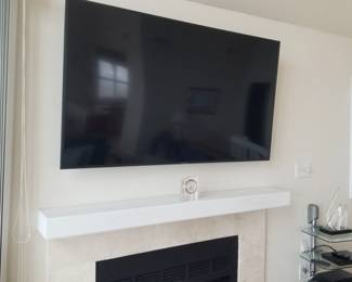 Large flat Samsung screen TV with wall mount