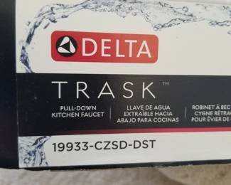 Delta TRASK pull down faucet - new in box. Polished chrome finish