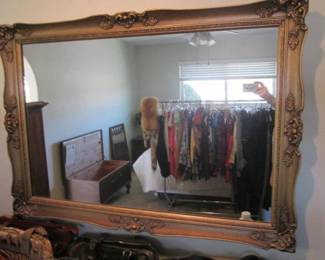 Several Wall-Hung Mirrors