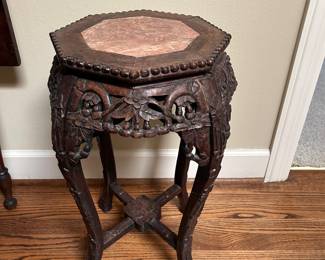 Lot #62 - $150 carved stand with octagonal top. some damage to side. 24"H x 14"W
