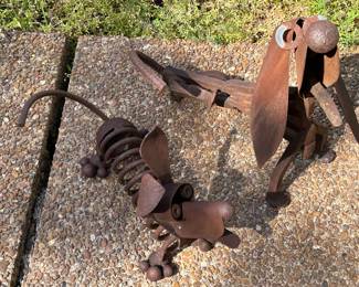 Lot # 211 - $60 -2 metal dogs. Small dog is 15"x9"x8". Large dog is 17-1/2" x 17" x 8"