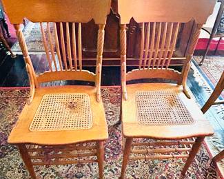 $50 ~ PAIR OF VTG CANE BOTTOM OAK CHAIRS. See photo for condition.  (To purchase or inquire about this item, please text 470.370.0348.)