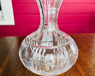 $40 ~ HEAVY CRYSTAL/GLASS DECANTER. See photo for very minor chip on bottom. Measures approximately 7"h x 6"w.  (To purchase or inquire about this item, please text 470.370.0348.)