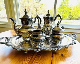 $225 ~ ROYAL ENGLISH COFFEE/TEA SET BY WALLACE, INCLUDES FOOTED TRAY, COFFEE, TEA, CREAM & SUGAR. SILVERPLATE. 25 YEARS OLD, NEVER USED. Footed tray measures approximately 25" x 16" x 2.25". Coffee is 9" high. Tea is 8.5" high. (To inquire about or to purchase this item, please text 470.370.0348.)