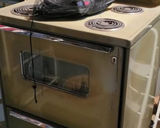 Old olive green G E stove