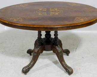 3883 - Rosewood inlaid tilting dinette table heavily carved pedestal, casters 27 x 46 x 23
