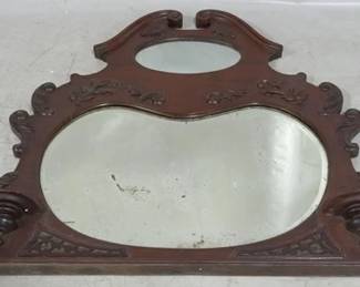 844 - Decoratively carved mirror, 42.5 x 50 wood has been reglued at crack
