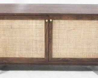 7073 - Union Home Canggu media stand plantation grown acacia, 2 curved doors with woven cane panel inserts conceal 2 shelves. 2 central cane doors house generous storage compartments with 2 adjustable shelves. 68" x 20" x 30.5"
