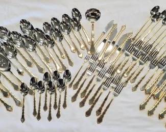 1062 - Oneida Golden Royal Chippendale Stainless Flatware 71 pieces in Total Table Knives - 8, Dinner Forks - 8, Ice Tea Spoons - 9, Salad/Dessert Forks - 8, Butter Knives - 7, Cocktail Fork - 1, Spoons - 8, Soup Spoons - 8 Gravy Ladle - 1, Slotted Serving Spoons - 3, Serving Spoons - 3, Pie Server - 2, Serving Forks - 2, Casserole Spoons - 2 & Oneida Golden Kenwood Serving Spoon - 1
