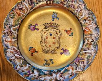 Numerous antique Capodimonte plates.