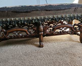 Antique hand carved bench with needlepoint cushion.