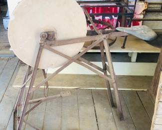 Treadle grinding stone with seat 
