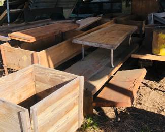 Lots of wooden boxes and tables 