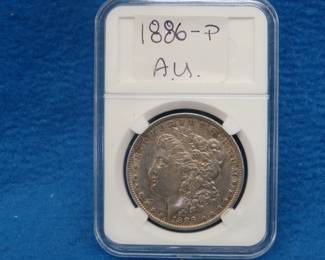 Lot 261. 1886 P Morgan silver dollar  A.U.
