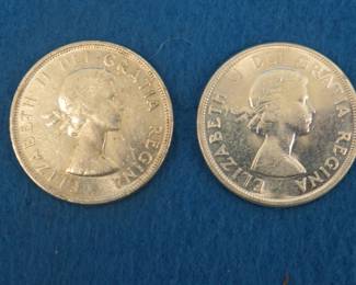 Lot 154. Two Canadian silver dollars.  1955 and 1963.