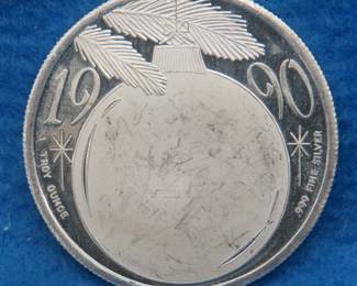 Lot 208. 1990 silver art round.  One ounce of .999 fine silver.