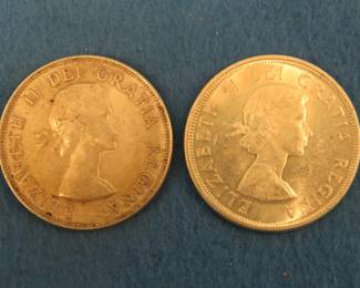 Lot 264. 1953 and 1964 Canadian silver dollars