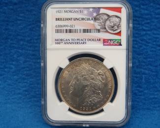 Lot 267. 1921 P Morgan silver dollar.  Graded BU by NGC.