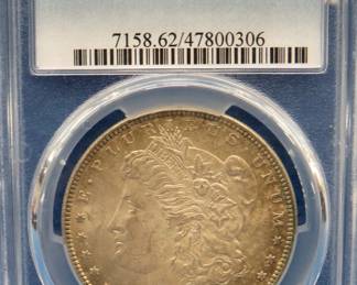 Lot 16. 1885 P Morgan silver dollar.  Graded MS62 by PCGS.
