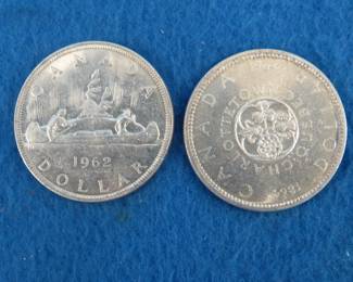 Lot 165. Two Canadian silver dollars.  1962 and 1964.