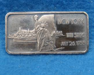Lot 317. New York State commemorative silver bar.  One ounce of .999 fine silver.