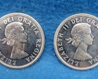 Lot 164. Two 1964 Canadian Charlottetown Quebec silver dollars