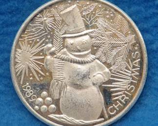 Lot 268. 1989 art round.  One ounce of .999 fine silver.