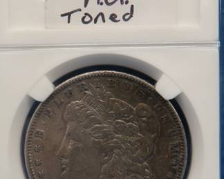 Lot 292. 1896 P Morgan silver dollar. A.U. toned