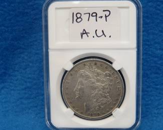 Lot 313. 1879 P Morgan silver dollar.  A.U.