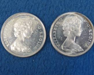 Lot 132. Two 1967 80% silver goose dollars