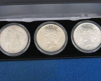Lot 219. 1921 D Morgan and 1922 P and 1923 P Peace Silver Dollars