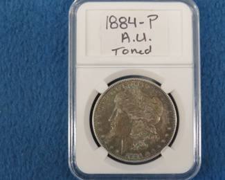 Lot 302. 1884 P Morgan Silver Dollar A.U. Toned