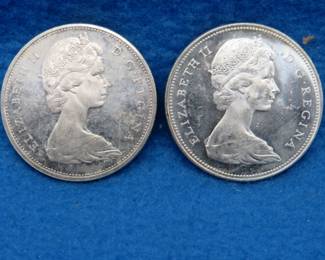 Lot 76. Two Canadian silver dollars.  80% silver.