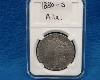 Lot 312. 1880 S Morgan silver dollar.  A.U.
