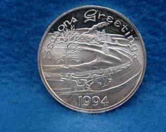 Lot 310. 1994 art round.  One ounce of .999 fine silver.