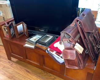 Storage Bench Seat, 31” Panasonic Television, MSU and Astros Towels and Banners