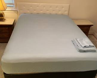 Queen Bed: Cream upholstered headboard, box and slats.  $350.00