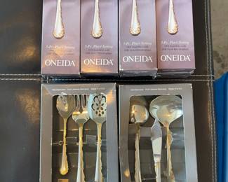 Oneida stainless flatware service for 12 and 6 serving pieces. Golden Belle Rose.  